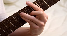 holding a barre chord